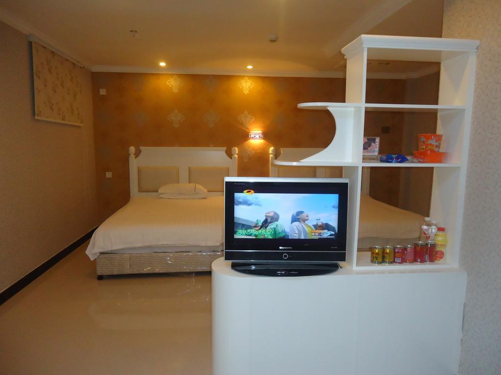 Omeiga Business Hotel I-wu Pokoj fotografie
