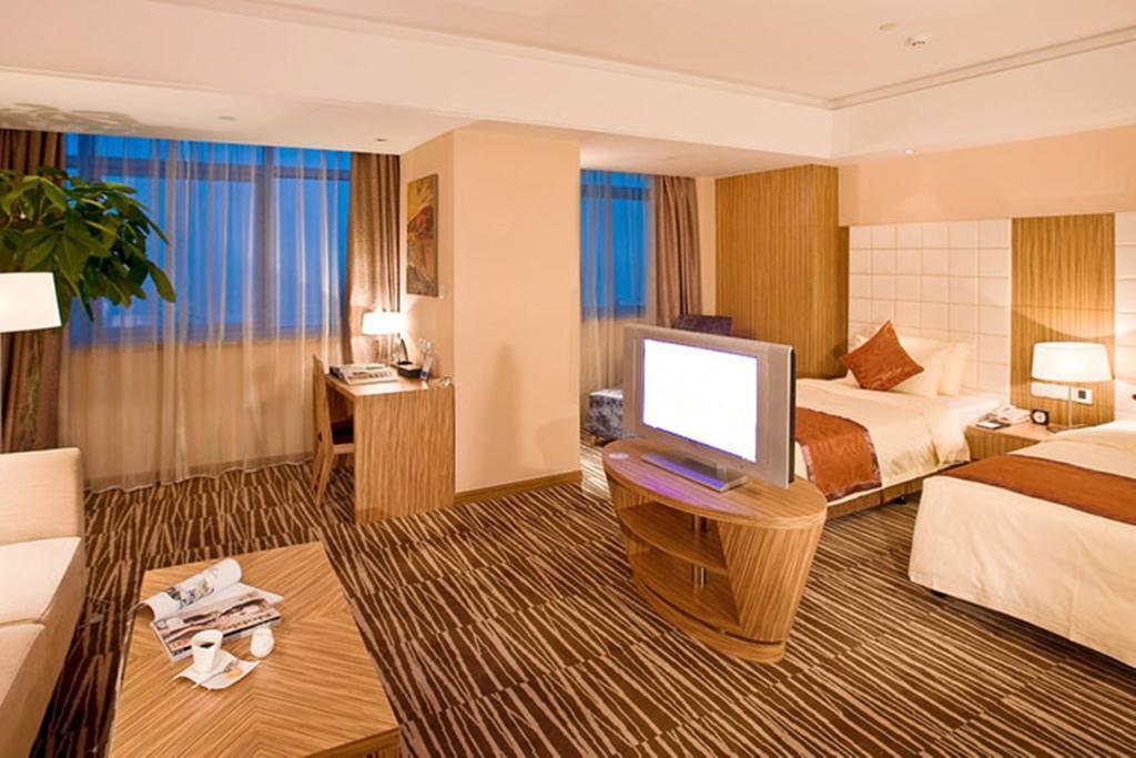 Omeiga Business Hotel I-wu Pokoj fotografie