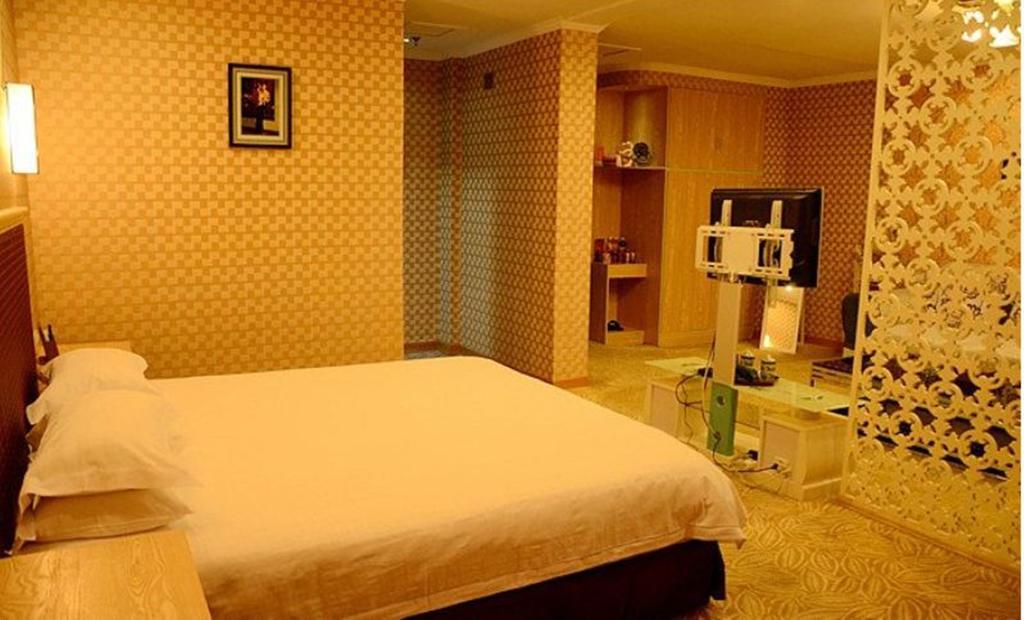 Omeiga Business Hotel I-wu Pokoj fotografie